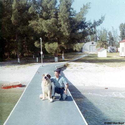 1967 - Don posing with Buster, our St. Bernard mascot at Coast Guard Station Lake Worth Inlet, on Peanut Island