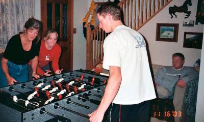 November 2003 - Brenda, Karen Dawn, and Brenda's son Justin Reiter playing Foosball