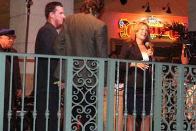TV newscaster Michelle Gillen speaking about Rick (left) at his retirement party