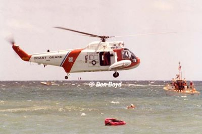 Early 1980's - air crew members of CG Reserve Unit Air Station Miami in wet drill training with HH-52A #CG-1419