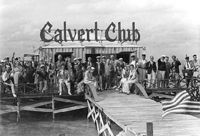 1938 - some of Miami's finest gents and ladies toasting at the Calvert Club in Stiltsville