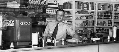 1940's - Harold Hubbard working the counter at Hubbard's Kubbard