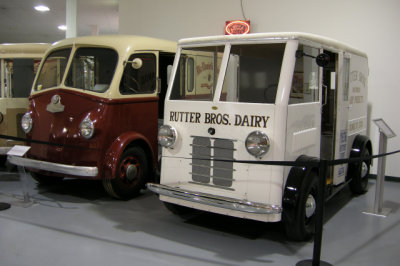 1936 Thorne C-1 gas/electric, right, and 1940 White Horse milk trucks (P5000)