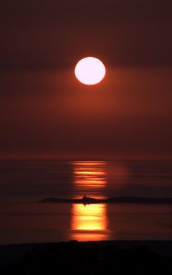 Sunset Over The Lighthouse At Newborough Warren