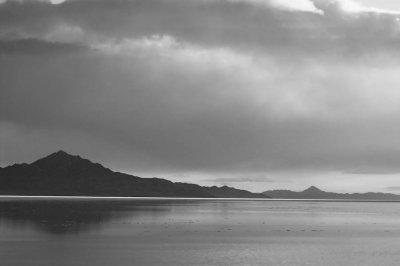 Mountains and clouds near flooded salt flats