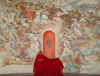 mural of skenderbej's victories, and helmet and sword