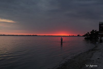 fisher at sunset