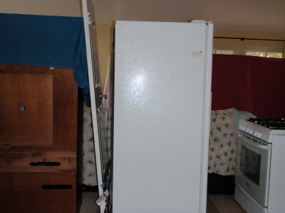Furniture/Kitchen Items Temporarily Stored in Living Room