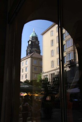 reflection ot the town hall tower in a window