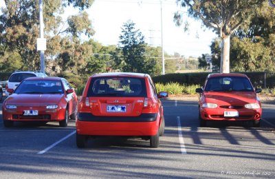 Three red cars