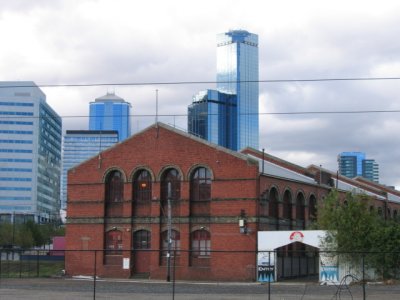 An old railway shed against the city background