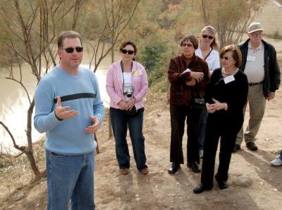 DSC_1364. Pastor Gary teaches on banks of Jordan River