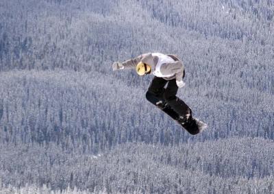 Another snowboarder in jumps competition