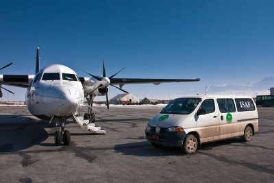 Fokker 50 and a car