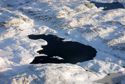 Dark lake in the snow