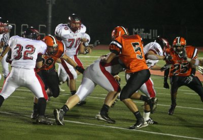 schlosser tackles the milford ball carrier