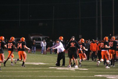 coaches welcome offense to the sideline after touchdown