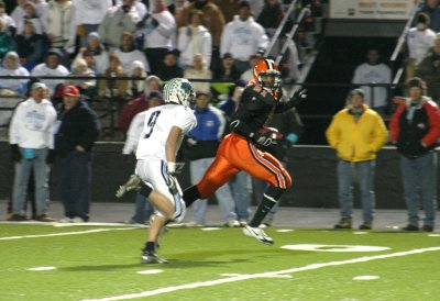 nick carries the ball toward the end zone