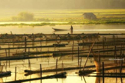 Sunrise over fish cages in Lake Sebu, South Cotabato