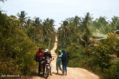 Locals on habal habal, narrow trail to the river