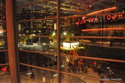 Winspear Opera House at night with Dallas skyline