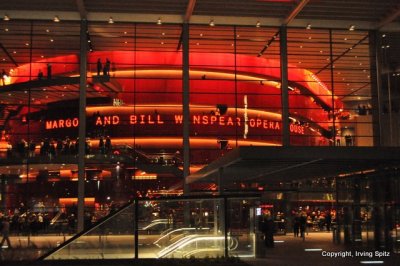 Winspear Opera House at night with Dallas skyline