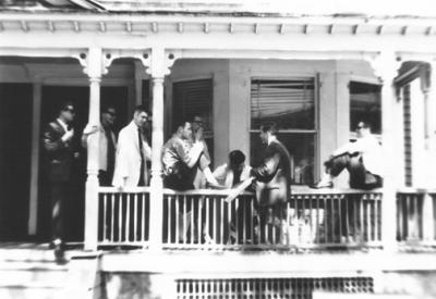 Scene at the fraternity house on Kenilworth Place (Brooklyn College) (1962). Guys in suits - must have been something special.