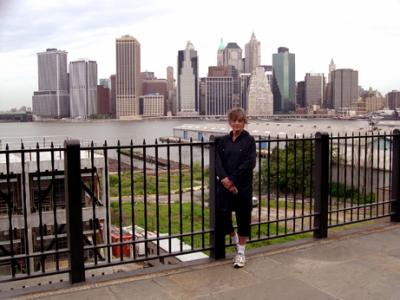 Judy on the Brooklyn Heights Promenade with part of the Manhattan skyline in the background