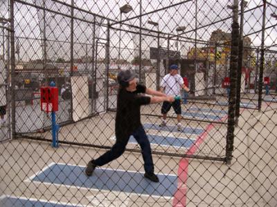 Richard at a baseball batting cage at Coney Island, Brooklyn, pretending to be 20 again. Seth is in the background.