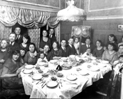 Dinner: Grandparents (father's side). Paul (Richard's father) is on grandpa's lap with grandma Gussie to his right. (circa 1918)