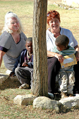 Janice, Annette and the children under the Tree of Friendship