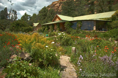 Stone flagged pathways lead to the homestead