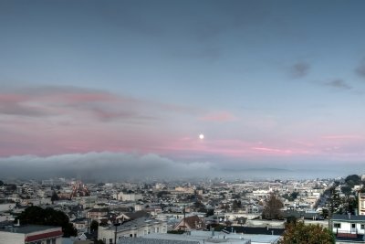 Moonrise at Sunset as the Fog Rolls In
