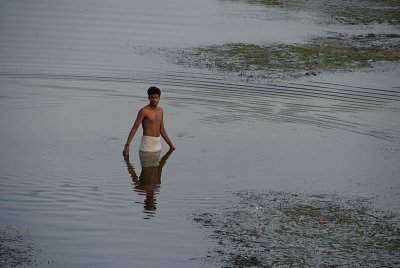 Man Stands in Water
