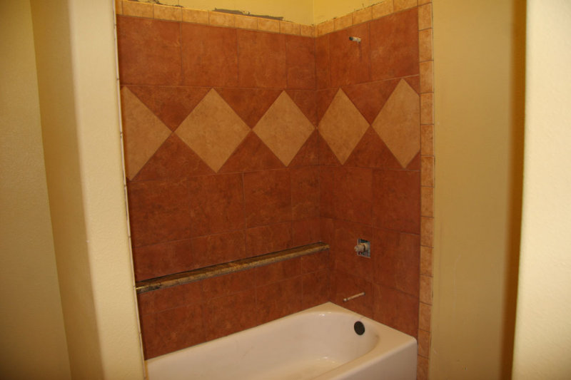 Grout is done in the guest bath