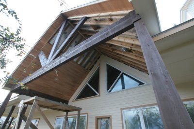 The wood under the front gable is over half way on one side