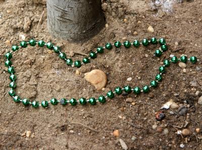 Left Green Beads by a Cherry Tree Trunk