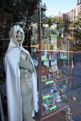 Anticipating Halloween - Religious Artifacts Store Window with Neighborhood Reflections