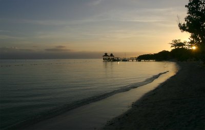 The beach and the dive center pier at sunrise