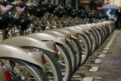 Automated rental bycicle stands can be found all over the old city.