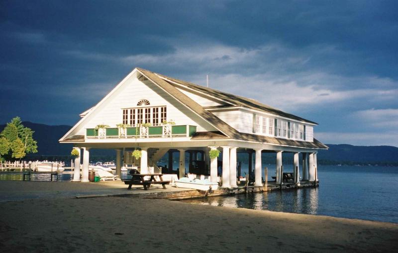 The sun breaks through over the boathouse at Still Bay Resort