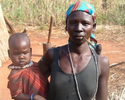 Woman With Pipe And Baby