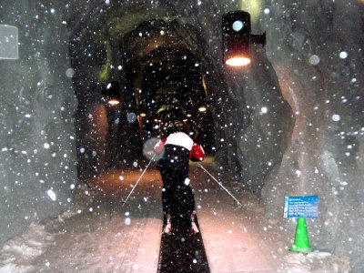 inside ski transport tunnel on a conveyor belt
