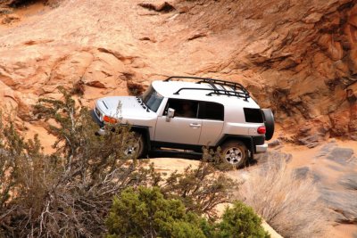Mom's Stock FJ looking for a rock to climb over