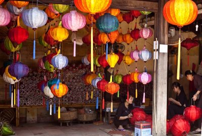 Adding the finishing touches to lanterns