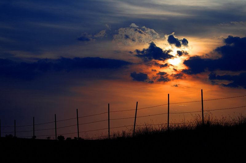 SUNSET  AND A FENCE