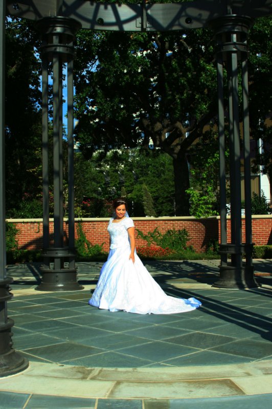 STANDING IN THE CIRCLE UNDER THE METAL GAZEBO