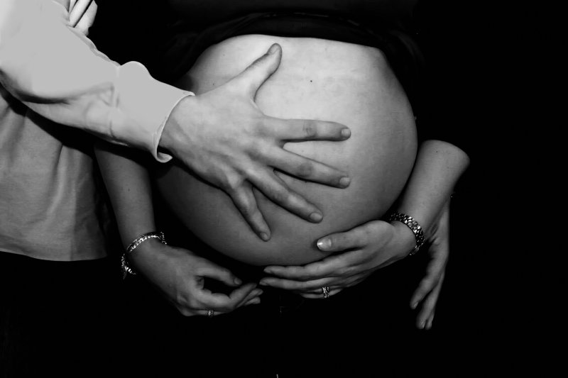 HAND ON HER BELLY