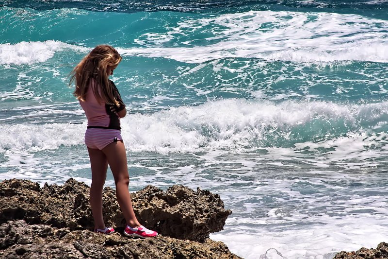 LITTLE GIRL ON THE ROCKS
