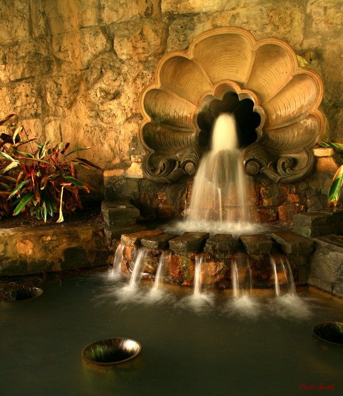 FOUNTAIN UNDER A BRIDGE ON THE RIVERWALK